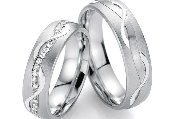 Silver wedding rings with wave pattern