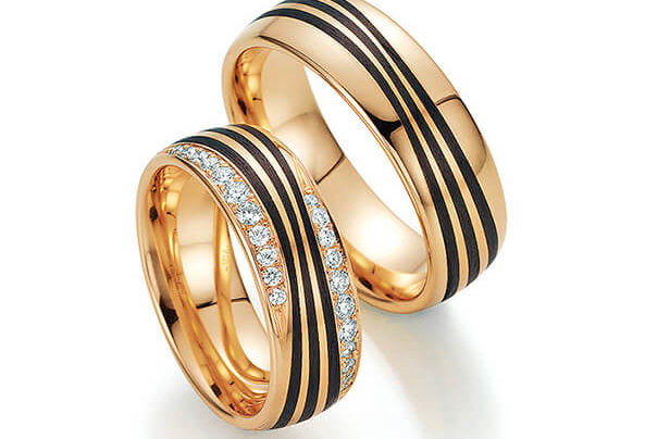 Golden wedding rings with a black stripe