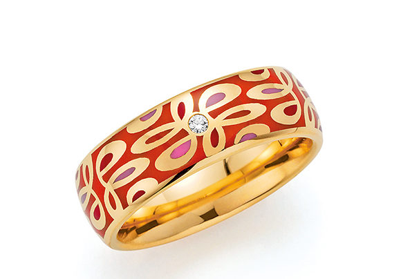 Golden ring with red pattern